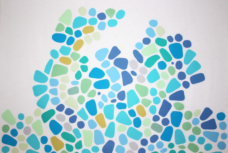May include: Abstract art piece featuring a pattern of irregular shapes in shades of blue, green, and yellow against a white background. The shapes vary in size and are arranged in a flowing, organic design.