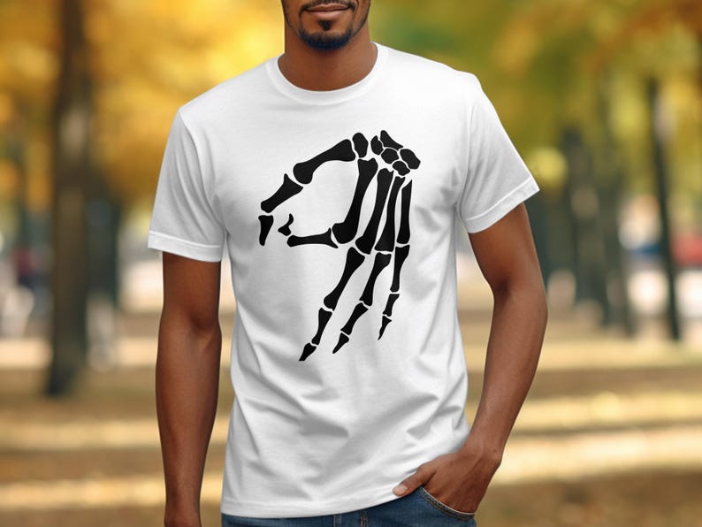 White t-shirt with black skeleton hand "okay" symbol graphic.