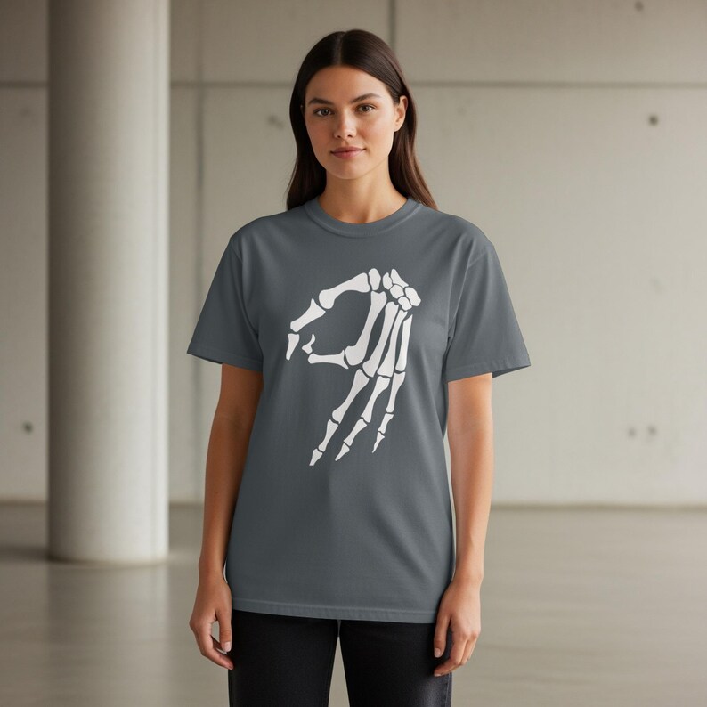 Dark grey t-shirt with white skeleton hand making the OK gesture.