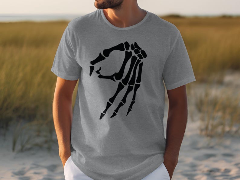 Gray t-shirt with a black skeleton hand making an "okay" gesture.
