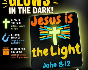 May include: Black rectangular magnet with the words "Jesus is the Light" and "John 8:12". The magnet glows in the dark and features a cross design with orange, blue, and yellow accents. The text "Perfect for VBS 2026" is also included.