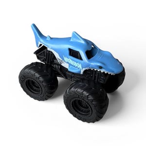 K&ouml;nnte beinhalten: Ein blaues Spielzeug-Monstertruck mit einem haif&ouml;rmigen K&ouml;rper. Der Truck hat gro&szlig;e schwarze Reifen und das Wort "MEGASHARK" ist auf der Seite aufgedruckt. Der Haik&ouml;rper hat eine Flosse oben und ein zahniges Grinsen.
