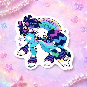 May include: A colorful sticker featuring a cartoon dog with a rainbow arch that reads "Sparkle Dogs." The dog has a blue and turquoise body with purple and black accents. The sticker has a white border and is decorated with stars.