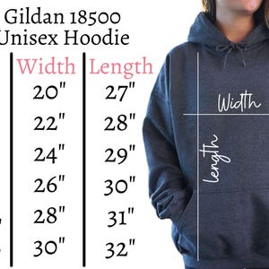 May include: A dark gray Gildan 18500 unisex hoodie. The image includes a size chart with measurements in inches: S (20" width, 27" length), M (22" width, 28" length), L (24" width, 29" length), XL (26" width, 30" length), 2XL (28" width, 31" length), and 3XL (30" width, 32" length).