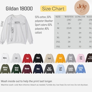 May include: A white Gildan 18000 sweatshirt with a size chart and color options. The size chart shows measurements in inches for width, length, and sleeve length. Available colors include white, ash, red, black, and more.