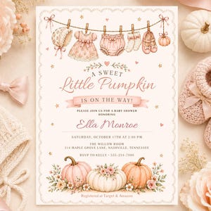May include: A rectangular baby shower invitation card featuring a scalloped edge and a clothesline illustration with baby clothing. The text reads A Sweet Little Pumpkin Is On The Way, Ella Monroe, Saturday, October 17th, and event details.