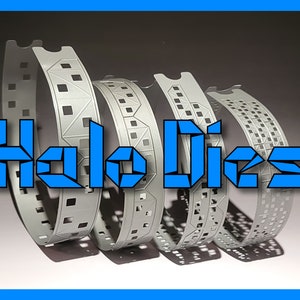 May include: Four silver metal bands with various geometric cut-out patterns are displayed in a row. The bands are curved, suggesting a circular shape. The text "Halo Dies" is superimposed in blue, block-style letters.