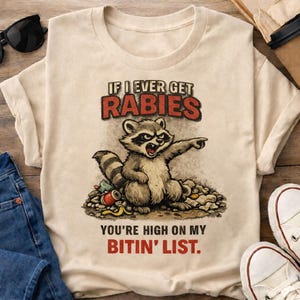 Mapache con lista de animales que muerden la rabia (Imagen digital para descargar)