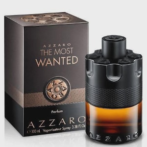 May include: Azzaro The Most Wanted Parfum bottle and box. The black bottle has a unique design with a dark amber liquid. The box is black with gold lettering and the words "The Most Wanted". The bottle contains 100 ml.
