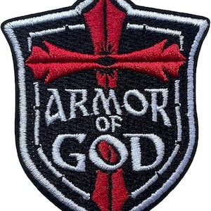 May include: A white ceramic mug with a black handle and the text "But First, Coffee" in a black, handwritten-style font. The mug is on a white surface.