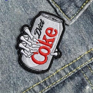 Skeleton Hand Holding Coke Can Embroidery Patch - Gothic Pop Art Iron On Applique for Edgy Denim Jackets & Cool Backpacks