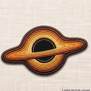 May include: Embroidered patch featuring a stylized black hole design. The patch has concentric rings of brown, orange, and yellow, with a black center. The patch is likely for clothing or accessories.
