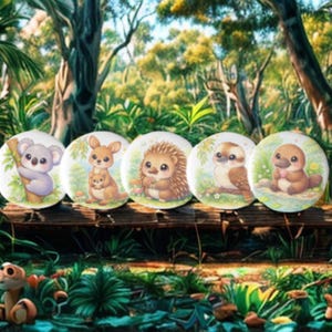 May include: Five circular decorative items showcasing cute cartoon animals: a koala, kangaroo with joey, hedgehog, owl, and platypus. Each has a white background with a colourful illustration of the animal. They are arranged on a wooden surface with a forest backdrop.