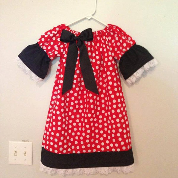Mini Mouse Polka Dot Peasant Dress with White Ruffle Trim and Removable Bow. Available in sizes newborn through size 12