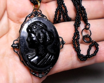 1 1920 Large Mourning Black Cameo Necklace, Tin Back, Celluloid, Black Brass Scalloped Setting on Black antique Tiny Seed Bead Necklace.