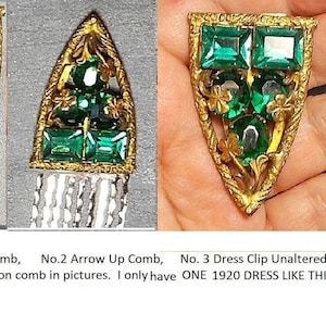 May include: Vintage gold-toned hair comb with emerald green rectangular and round rhinestones. The comb has an ornate, Art Deco design with clover accents. The text in the image says "Your Choice: No. 1 Arrow Down Comb, No. 2 Arrow Up Comb, No. 3 Dress Clip Unaltered."