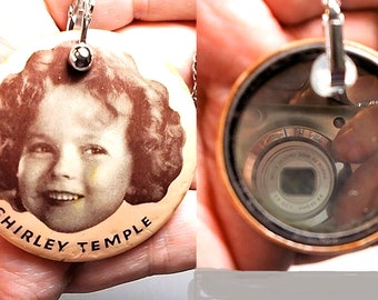 1935 (Marked) Shirley Timple Purse Mirror.  added Removeable Clasp Necklace/Chatelaine.  Good Condition on 20"  Necklace Highly Collectible