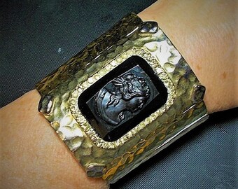 G P Hammered Black Cameo Cuff Brutalist Brass Rhinestones Heavy Wide Cuff on 4 Stretch Cords w/ Black Vintage Celluloid Cameo Added. Runway