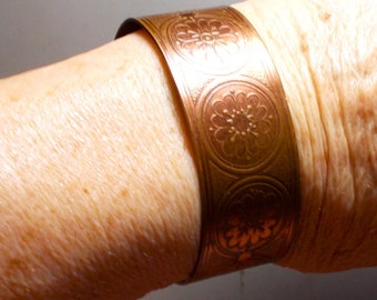 Flowered Copper Cuff, Said to Get Rid of Arthritis, From the 1960s.  Bracelet is in Good Condition,  Flexible.