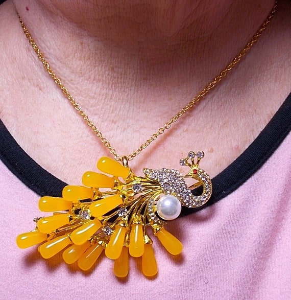 Egg Yolk Rhinestone Peacock Brooch Necklace.   3+"