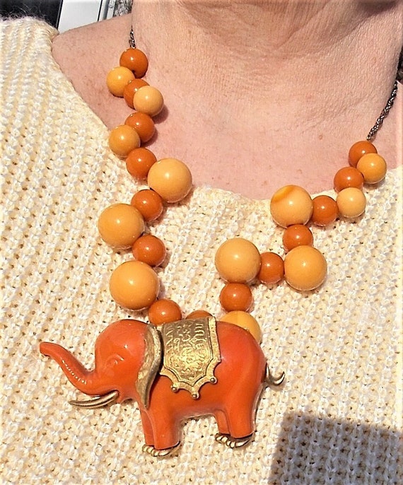 SALE Antique Coral Lucite Elephant w/ Heavy Gold … - image 1