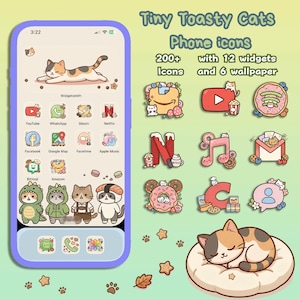 May include: A phone screen showcases cat-themed app icons, including YouTube, Netflix, and Facebook. The image also features a sleeping cat on a cushion, paw prints, and the text "Tiny Toasty Cats Phone icons" in a playful font.