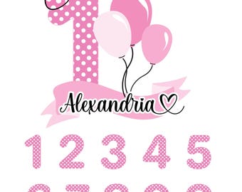 May include: A digital graphic featuring a large pink number one with white polka dots, topped with a matching bow. Three pink balloons are attached, and a banner displays the name Alexandria with a heart. Below are numbers zero through nine.