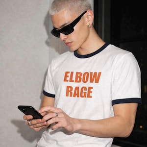 Elbow Rage Penny Ringer T-Shirt, Funny Y2K Graphic, Retro 2000s Nostalgia