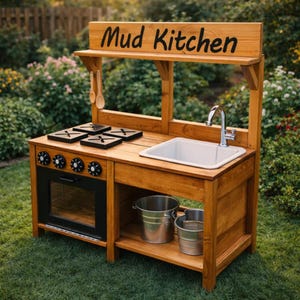 May include: A wooden mud kitchen with a sign that reads "Mud Kitchen". The kitchen features a sink, stove top, oven, and storage shelf. Two metal buckets sit on the shelf. The kitchen is made of light brown wood and is set on a grassy lawn.