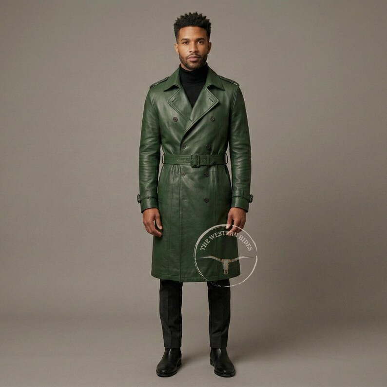 May include: A long, green leather trench coat with a double-breasted design and a belt at the waist. The coat has a classic trench coat style with a notched collar and button details. The coat is worn with black pants and a black turtleneck.