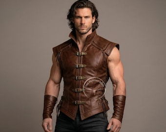 May include: A brown leather vest with a high collar and brass buckles. The vest has a sleeveless design and is paired with matching wrist cuffs. The image shows a man wearing the vest, with a neutral background.
