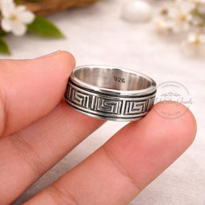 May include: A set of three ceramic mugs with a speckled, matte finish. The mugs are in shades of cream, light brown, and dark brown. Each mug has a simple, minimalist design, perfect for coffee or tea.