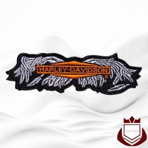 May include: Black Harley-Davidson patch with an orange and white logo. The patch features the Harley-Davidson logo in an orange rectangle, with white wings and text. The patch is rectangular with a black border.