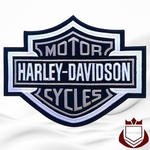 May include: A black and white Harley-Davidson Cycles patch. The patch features the Harley-Davidson logo with the words "MOTOR" and "CYCLES" above and below "HARLEY-DAVIDSON" in white, embroidered lettering. The patch has a black border with white stitching.