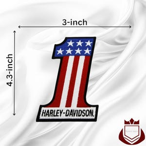 May include: Embroidered patch in the shape of the number one, 4.3 inches tall and 3 inches wide. The top section is blue with white stars, and the lower section has red and white stripes. The text "HARLEY-DAVIDSON" is at the bottom.