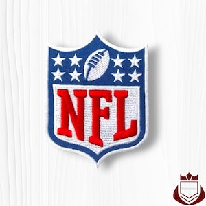 May include: Embroidered NFL patch featuring the league's logo. The design includes a blue shield with white stars, a white football, and the red letters "NFL". The patch has a white border and is likely for apparel.