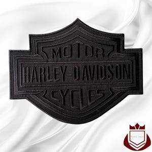 May include: Black Harley-Davidson Cycles patch with embroidered text and a shield design. The patch features the words "MOTOR HARLEY-DAVIDSON CYCLES" in a layered, textured style. The patch is set against a white background.