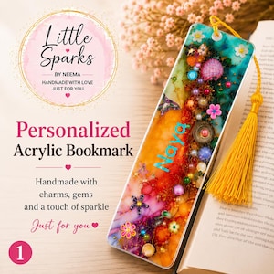 May include: A rectangular acrylic bookmark featuring a vibrant, multi-colored abstract background with embedded small beads, gems, and floral charms. The name Naya is printed in light blue script. A yellow tassel is attached to the top hole.