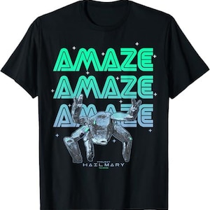 May include: Black t-shirt with the word "AMAZE" stacked three times in a gradient of green and blue. A metallic figure with raised hands is below the text, with the words "PROJECT HAILMARY" at the bottom.