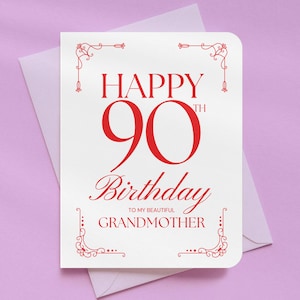 May include: A white birthday card with red text and decorative flourishes. The card reads "HAPPY 90TH BIRTHDAY TO MY BEAUTIFUL GRANDMOTHER." The card is inside a white envelope, set against a light purple background.