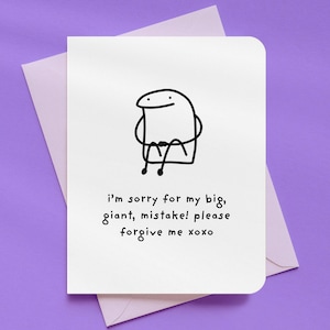 May include: A white greeting card with a simple black line drawing of a figure with its arms crossed. The card has the text "i'm sorry for my big, giant, mistake! please forgive me xoxo" and is inside a lavender envelope.