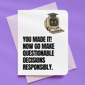 May include: A white greeting card with the text "YOU MADE IT! NOW GO MAKE QUESTIONABLE DECISIONS RESPONSIBLY." features a cartoon computer wearing a graduation cap. The card is inside a lavender envelope.