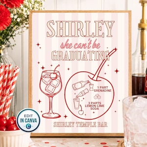 May include: A rectangular sign with a light pink and white striped background featuring the text SHIRLEY she can't be GRADUATING. It includes a cocktail glass illustration, a large cherry graphic with a recipe for a Shirley Temple bar.