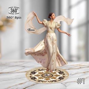 May include: A cream-colored gown with gold embroidery and a flowing scarf. The dress features a V-neckline and puffed sleeves. The image includes the text "Emma" and "360° Spin". The figure is standing on a decorative round base.