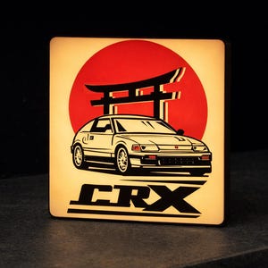 May include: A rustic wooden sign with the text "Welcome to our home" in white lettering. The sign has a distressed finish and a simple, inviting design, ideal for entryway decor.