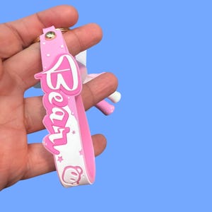 May include: A rustic wooden sign with the text "Welcome to our home" in a handwritten style. The sign features a distressed finish and a simple, inviting design, perfect for a front porch or entryway.