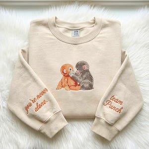 Sudadera con mono bordado, Team Punch, diseño "Nunca estás solo"