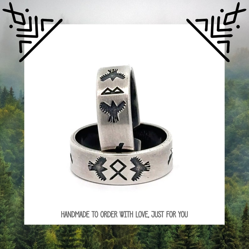 May include: Two silver rings with black etched designs. The top ring features a bird design, while the bottom ring features a bird and a symbol. The rings are stacked on top of each other. The text "HANDMADE TO ORDER WITH LOVE, JUST FOR YOU" is at the bottom of the image.