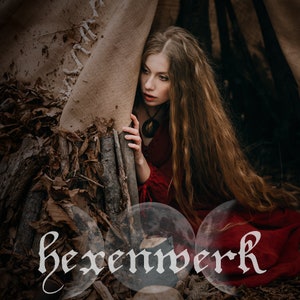 May include: A woman with long brown hair wearing a red dress peeks out from behind a wooden structure. The word "hexenwerk" is written in white script on a blurred background of three moons.