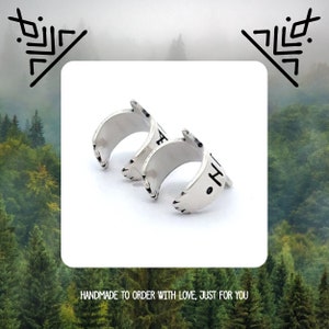 May include: Two silver rings with a textured finish. The rings are stacked on top of each other. The top ring has the word "Faith" inscribed on it. The bottom ring has the word "Hope" inscribed on it. Handmade to order with love, just for you.